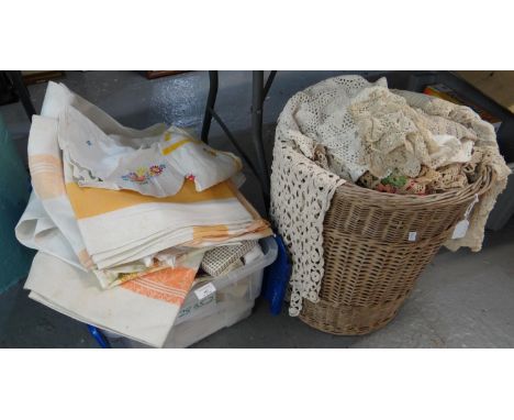 A wicker basket and a box full of vintage textiles to include: a large collection of crochet doilies, place mats etc, linen t