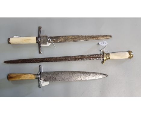 Three 19th century daggers, one with heavily figured foliate decorated blade and brass mounted bone handle, a second with ste