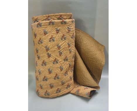 Vintage cotton Welsh quilt with leaf and swirl designs; floral to one side and light brown to reverse. (B.P. 21% + VAT)