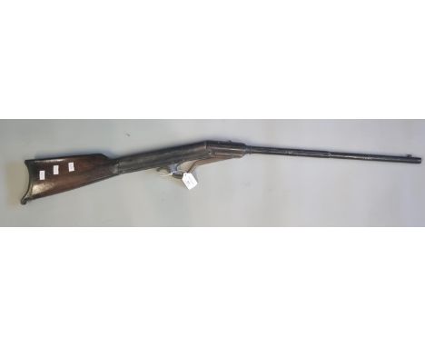 Heavy vintage break action air rifle with half octagonal barrel and short stock with metal butt plate.  Appearing unmarked.  