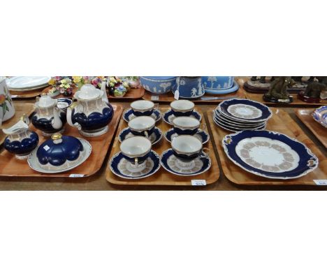 Two trays of china to include: two blue and white willow pattern meat plates; one Staffordshire stone china, two German Weima