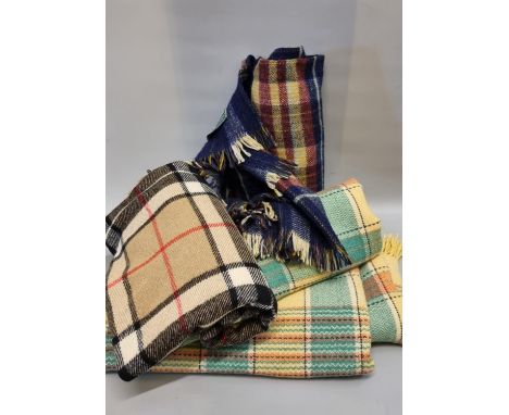 Box containing one vintage blanket or carthen with fringed edge, a 'House of Tweed' plaid throw and another check design thro