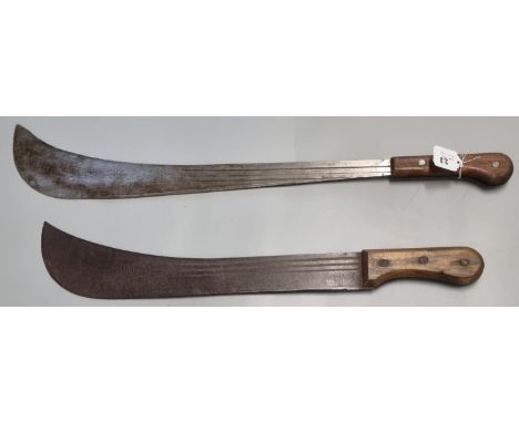 Two vintage Parang type jungle knives or Machetes with wooden grips and fullered curved single edged blades.  One marked 'Spe