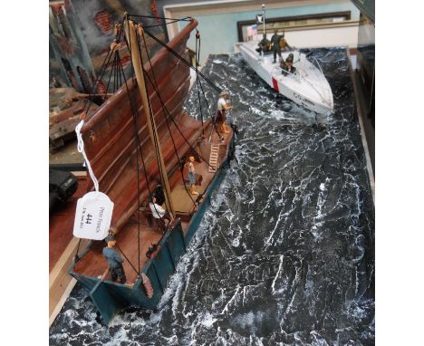 Model diorama on naturalistic seascape base of a USA Gunboat and a native sailing vessel.  (B.P. 21% + VAT) 