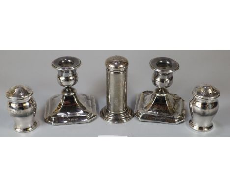 Bag of silver to include pair of dwarf candlesticks with loaded bases, pepperette and a pair of silver condiments, the three 