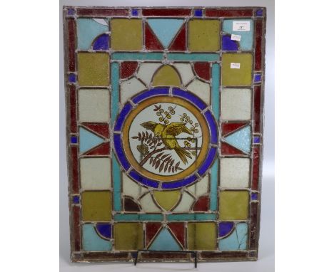 Arts and Crafts design stained and leaded glass panel, the central circular panel decorated with a bird and butterfly on a br