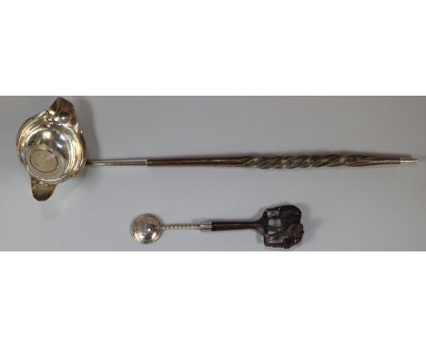 Silver brandy/toddy ladle inset with silver coin with narwhal handle together with a souvenir spoon with hardwood Elephant mo