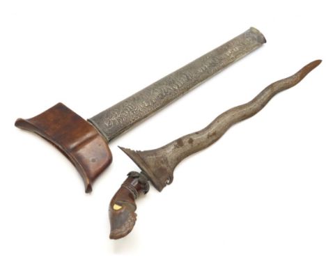 An antique Malayan Kris with ornate white metal scabbard & bone inlay to handle