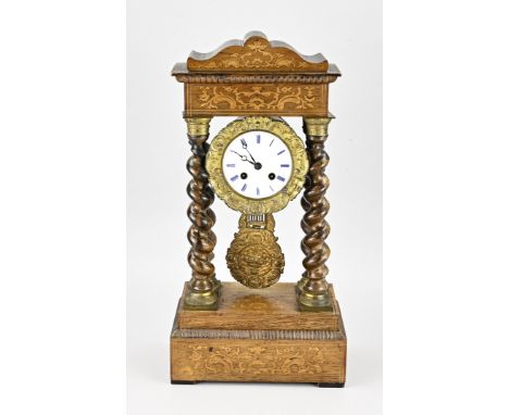 19th century French column mantel clock with twisted columns. Louis Philippe. Circa 1860. Eight-day movement, half-hourly str