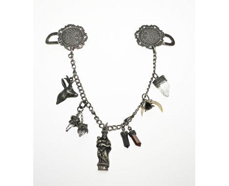 Silver trouser chain, 835/000, with a pendant with teeth, a pendant with a deer's head, a Mary with child, and 3 pendants wit