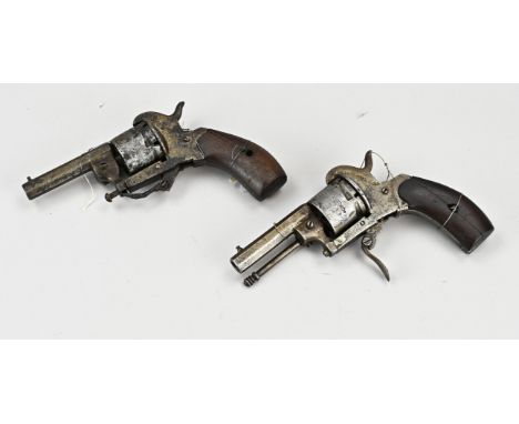 Two antique revolvers. 1x The most perfected model of 1908, marked with R + crown. 1x ditto. Strongly oxidized. Dimensions: L