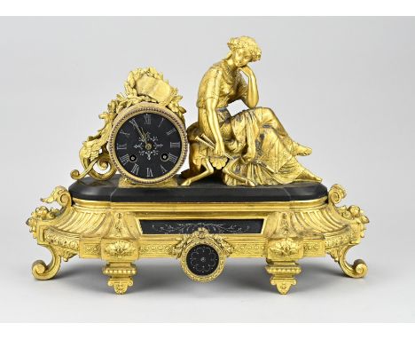Antique French Louis Philippe mantel clock with black marble. Circa 1870. Eight-day movement, spring pendulum. Gilded composi