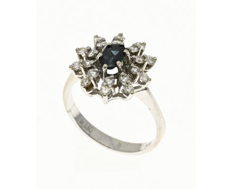 White gold ring, 585/000, with diamond and sapphire. Ring with a rosette in the center set with an oval faceted sapphire and 