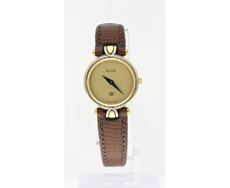 Gucci ladies watch, 4500L, Bicolour round model with 18 carat gold plating. Equipped with a gold-colored dial with black hand