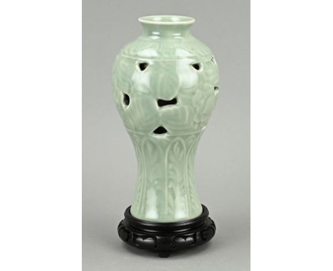 Chinese porcelain celadon vase on console. Openwork vase. 20th century. Dimensions: H 20 cm. In good condition.