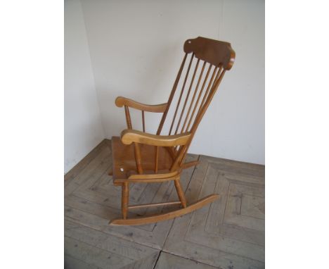 Lightwood stick back rocking chair on turned supports 