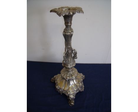 Elaborate silver plated candlestick on three raised supports with embossed detail (42cm high)