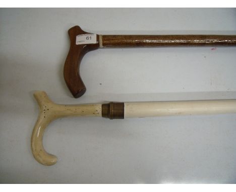 White walking stick with white ceramic handle and another wooden walking stick (2)