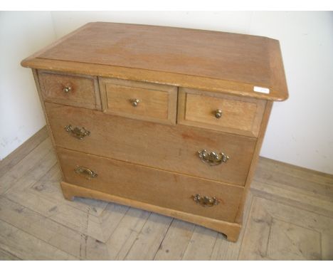 Small Stag chest of three short above two long drawers on raised bracket supports (82cm x 49cm x 67cm)
