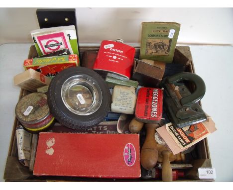 An interesting wooden crate containing a selection of various items including tyre ashtray, hip flasks, various pocket guides
