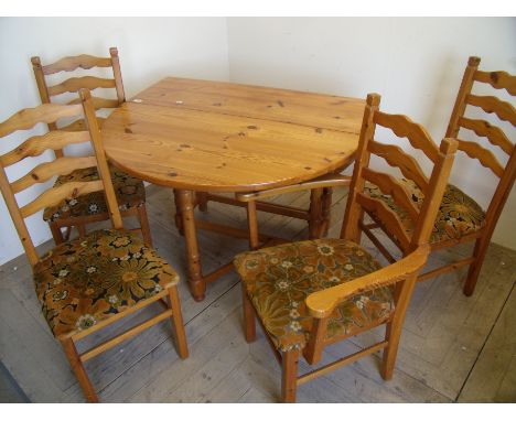 Pine drop leaf table and a set of four (3+1) ladder back dining chairs 