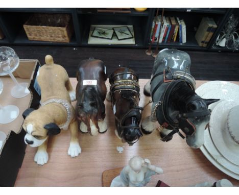 A Leonardo figurine of a Boxer puppy and three ceramic figurines, working horses