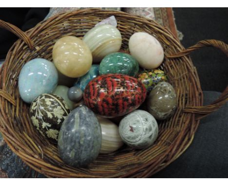 A basket of eggs including papier mashe, agate, ceramic, marble etc 