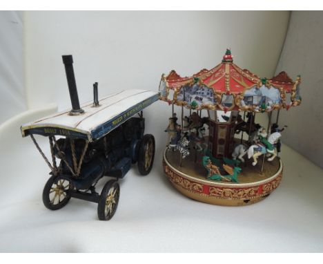 A Mamod style steam engine and a Mr Christmas model carousel 