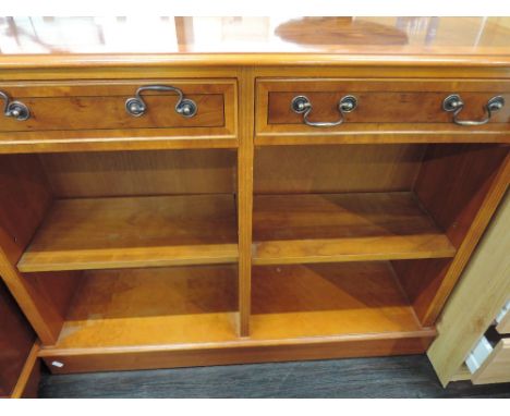 A modern yew wood  low book shelf with drawers