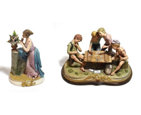 A large Capodimonte group of boys playing cards; together with a Capodimonte figure of a classical maiden (2)