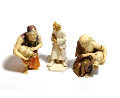 A pair of Royal Worcester water carrier figures and another figure (3)