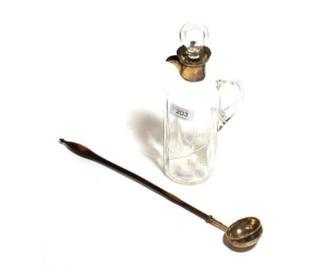 A silver mounted whisky jug and a toddy ladle 