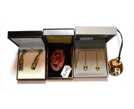 A pair of Lalique drop earrings; a red and black ceramic brooch and matching drop earrings; a pair of granite drop earrings, 