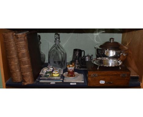 Two leather bound bibles, a silver-plated tureen, two glass decanters, a Delft tile, modern enamel boxes, coins etc