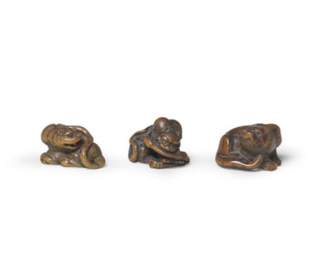 THREE WOOD TIGER NETSUKEEdo period (1615-1868) to Meiji era (1868-1912), 19th centuryThe first a tiger turning back with its 
