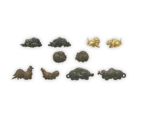 FIVE SETS OF MENUKI (HILT GRIPS)Edo period (1615-1868), 18th and 19th centuryThe first copper, as a rooster and hen, signed M