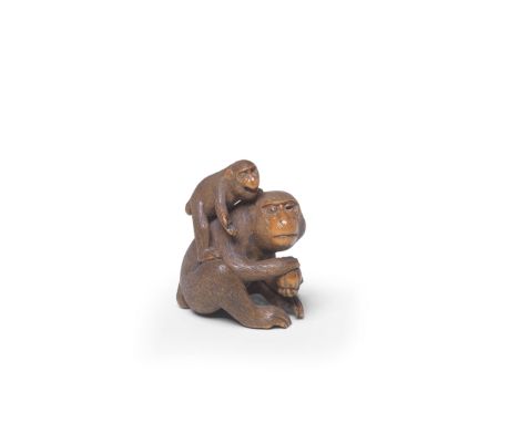 A WOOD NETSUKE OF TWO MONKEYSBy Sadakazu, Edo period (1615-1868), 19th centuryThe adult monkey seated and holding a peach wit