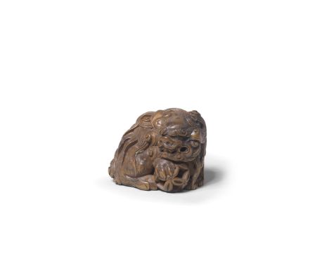 A WOOD NETSUKE OF TWO SHISHIBy Sato Masayoshi (1819-1865), Edo period (1615-1868), mid-19th century The adult shown seated lo