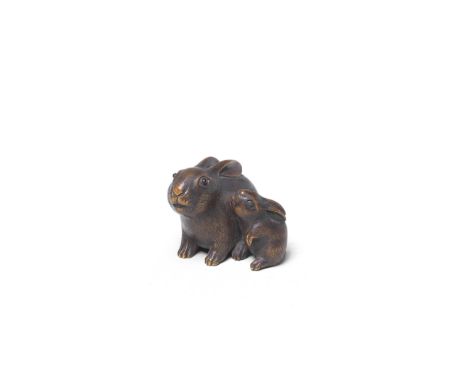 A WOOD NETSUKE OF TWO RABBITSBy Masanao, Yamada, Ise Province, Edo period (1615-1868), 19th centuryThe adult seated with her 