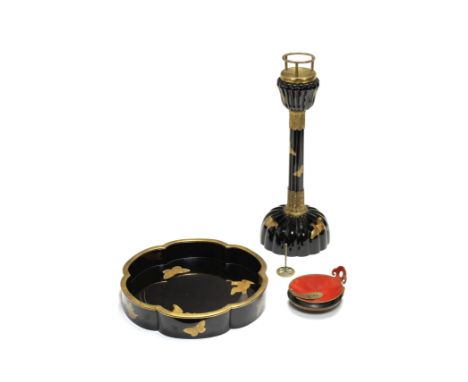 A BLACK-LACQUER MATCHING CANDLESTICK AND TRAY WITH AN OIL DISHMeiji era (1868-1912), late 19th/early 20th centuryThe candlest