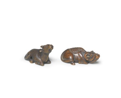 TWO WOOD NETSUKE OF RECUMBENT OXENEdo period (1615-1868) to Meiji era (1868-1912), 19th centuryThe first seated with its head