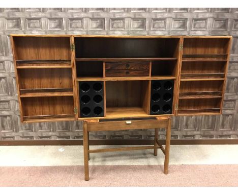 ROSEWOOD OBLONG DRINKS CABINET By Robert Heritage for Archie Shine, the fitted interior of open shelves, small drawers and bo