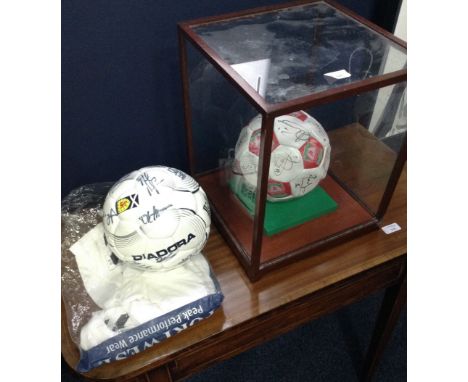 AUTOGRAPHED LIVERPOOL FOOTBALL CLUB BALLsigned by the team of the 2005/06 season, contained within a perspex case; along with