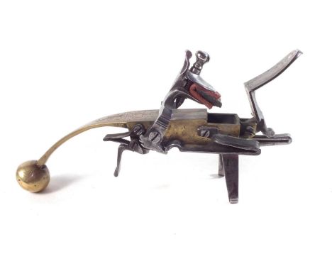 18th-century brass and steel flintlock tinder pistol lighter, the handle engraved with a recumbent stag and scrolls.19cm long