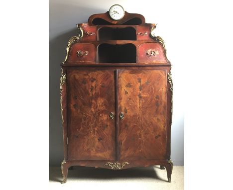 A 19th century French marquetry inlaid ormolu mounted clock cabinetThe top surmounted with a barrel clock with white enamel d