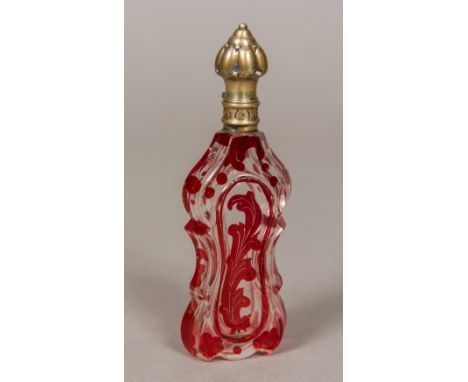 A 19th century ruby and clear glass scent bottleOf flattened waisted form with silver hinged lid.  13 cm high.    CONDITION R