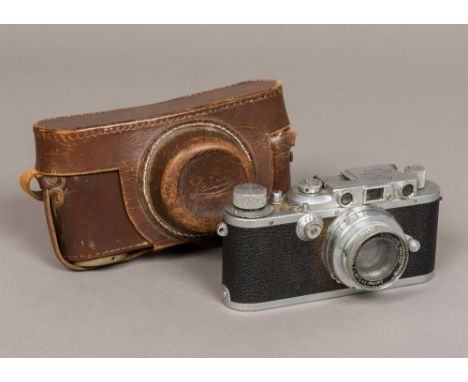 A Leica D.R.P. Ernst Lietz Wetzlar camera, No. 304311With Ernst Lietz Wetzlar Summar lens, number 466943, in leather case.   