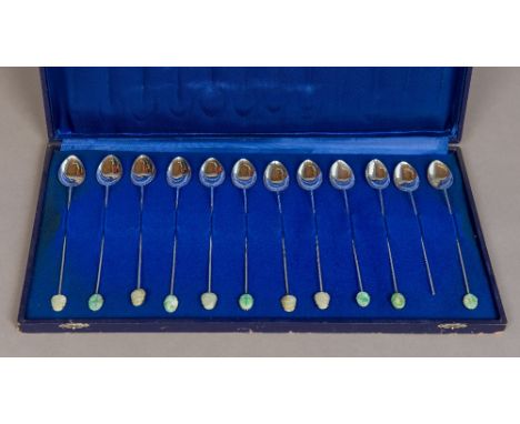 A set of twelve Chinese silver spoonsEach with faux bamboo stem and carved jade terminal, stamped Made in Hong Kong and Silve