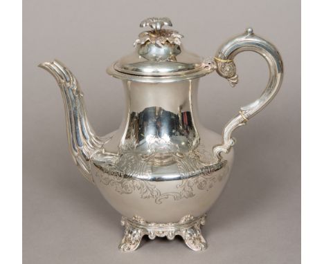 A George III silver teapot, hallmarked London 1796, maker's mark of JB over WNOf baluster form, with engraved scroll decorati