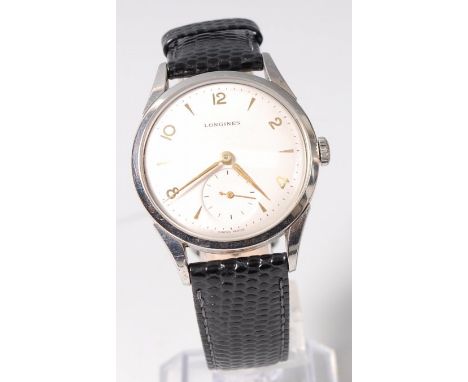 A gents Longines steel cased wristwatch, having signed silvered dial with alternating Arabic numerals and baton markers, subs